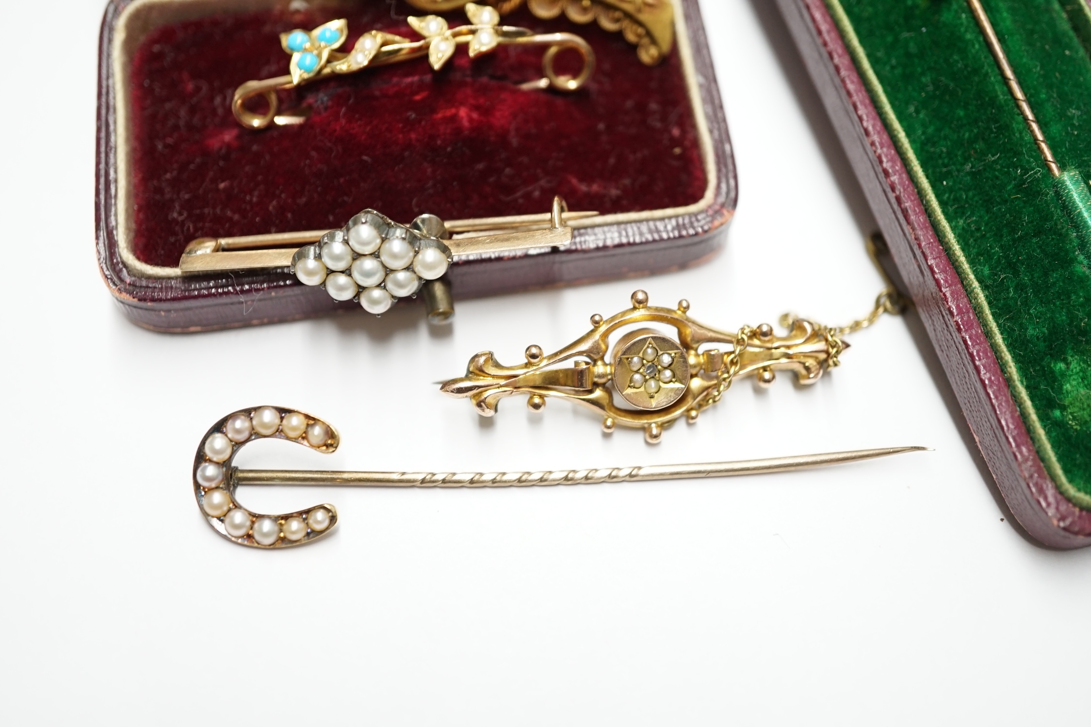 A 15ct gold, ruby and diamond set bar brooch, four other bar brooches including 9ct and two stick pins. Condition - poor to fair